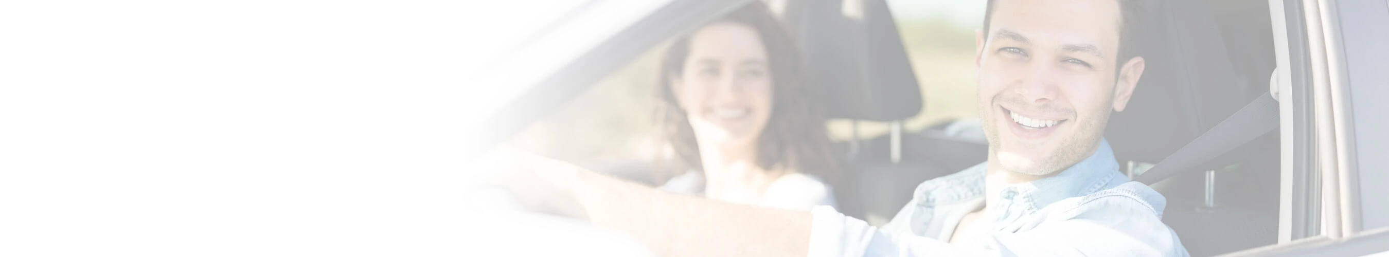 man driving car smiling