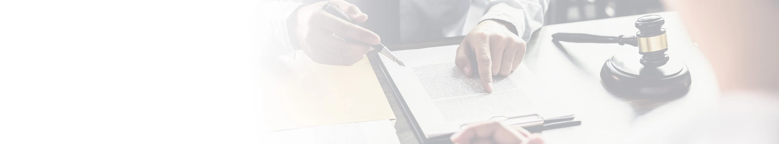 Two people writing on legal documents